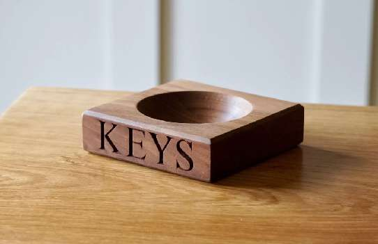 A wooden key bowl