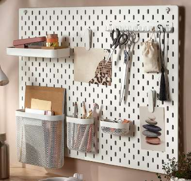 a wall pin board thing with several pots and small hooks and shelves attached. In the photo it is being used for craft supplies, but I have also seen it used for keys and other little things.